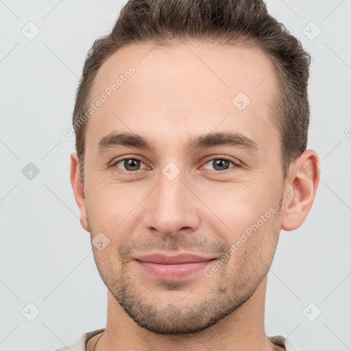 Joyful white young-adult male with short  brown hair and brown eyes