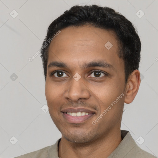 Joyful latino young-adult male with short  black hair and brown eyes