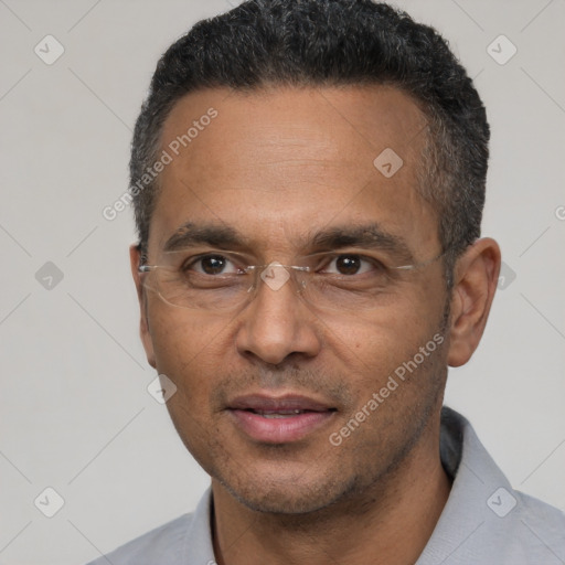 Joyful latino adult male with short  black hair and brown eyes