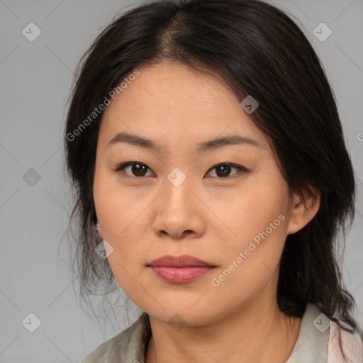 Joyful asian young-adult female with medium  brown hair and brown eyes