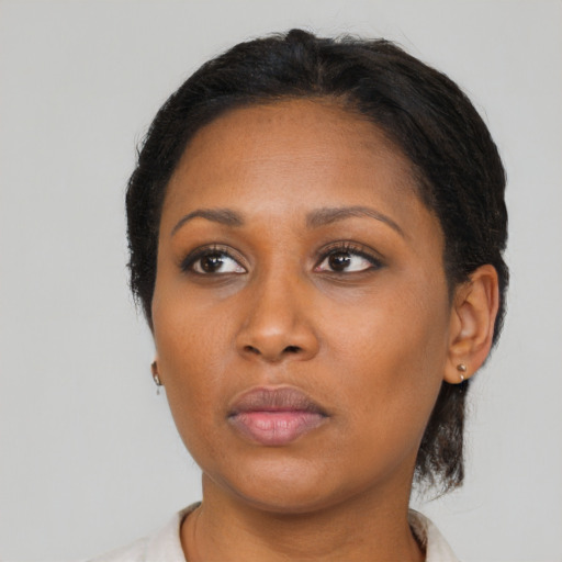Neutral black adult female with medium  brown hair and brown eyes
