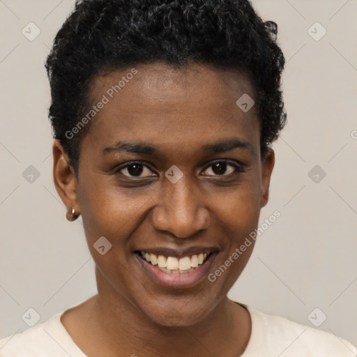 Joyful black young-adult female with short  black hair and brown eyes