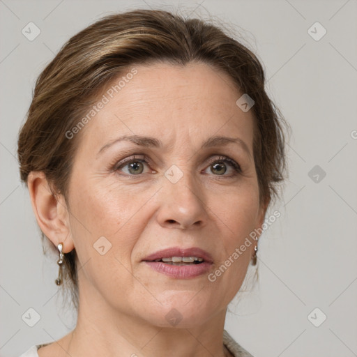 Joyful white adult female with medium  brown hair and grey eyes