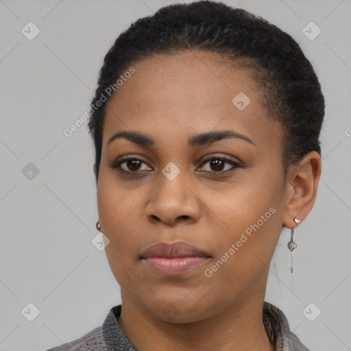 Joyful black young-adult female with short  black hair and brown eyes