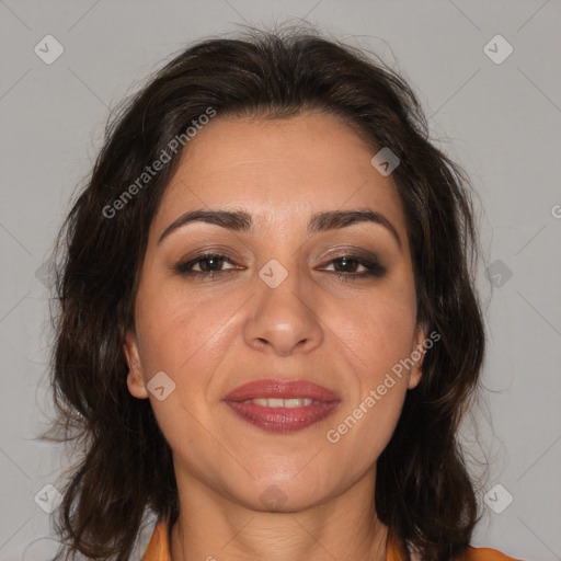 Joyful white adult female with medium  brown hair and brown eyes