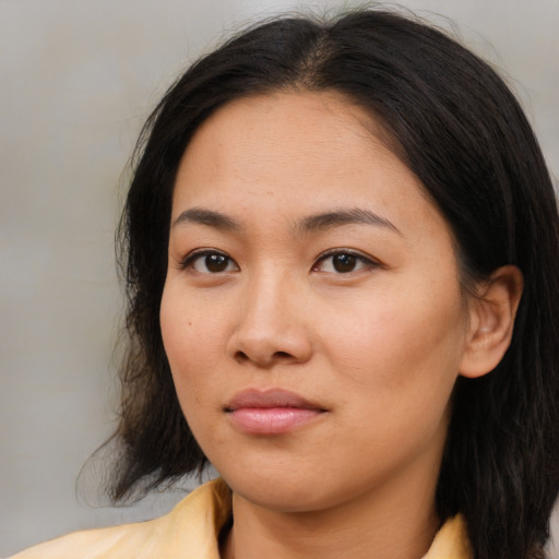 Neutral asian young-adult female with medium  brown hair and brown eyes
