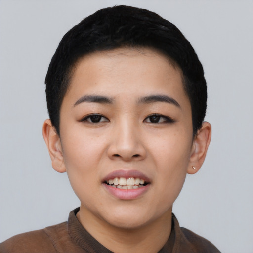 Joyful asian young-adult female with short  black hair and brown eyes