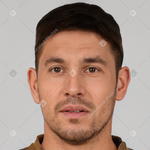 Joyful white adult male with short  brown hair and brown eyes