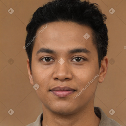 Joyful latino young-adult male with short  black hair and brown eyes