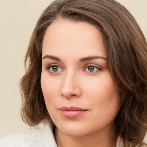 Neutral white young-adult female with medium  brown hair and green eyes