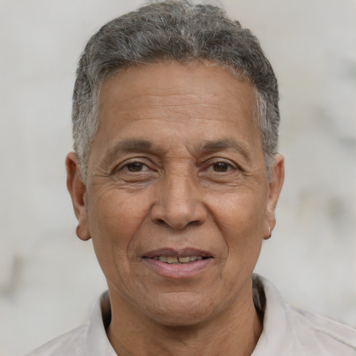 Joyful white middle-aged male with short  gray hair and brown eyes