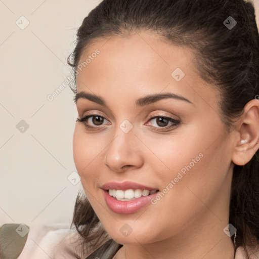 Joyful white young-adult female with long  brown hair and brown eyes