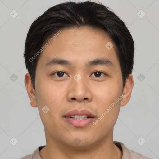 Joyful asian young-adult male with short  brown hair and brown eyes