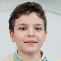 Joyful white child male with short  brown hair and brown eyes