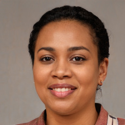 Joyful latino young-adult female with medium  black hair and brown eyes