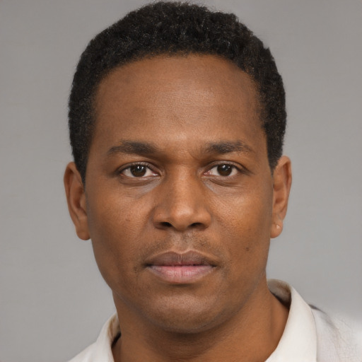 Neutral black young-adult male with short  brown hair and brown eyes