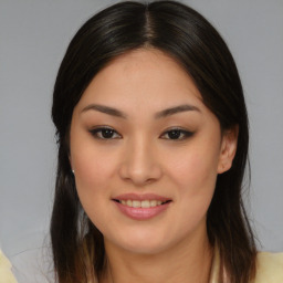 Joyful latino young-adult female with medium  brown hair and brown eyes