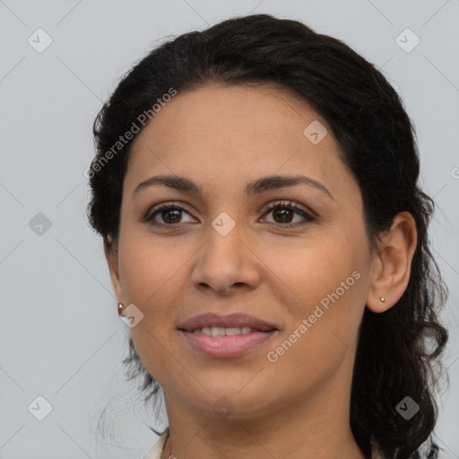 Joyful latino young-adult female with long  black hair and brown eyes