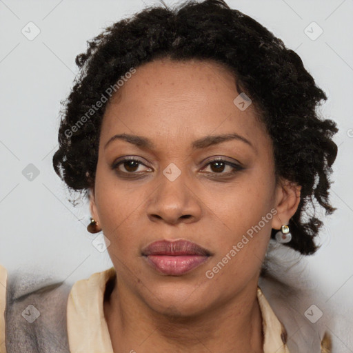 Joyful black adult female with short  brown hair and brown eyes