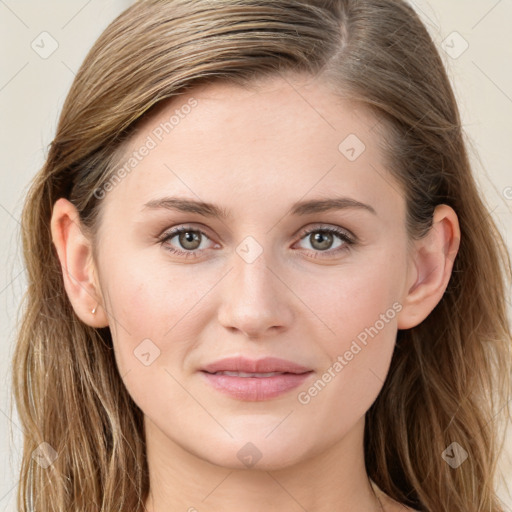 Joyful white young-adult female with long  brown hair and blue eyes