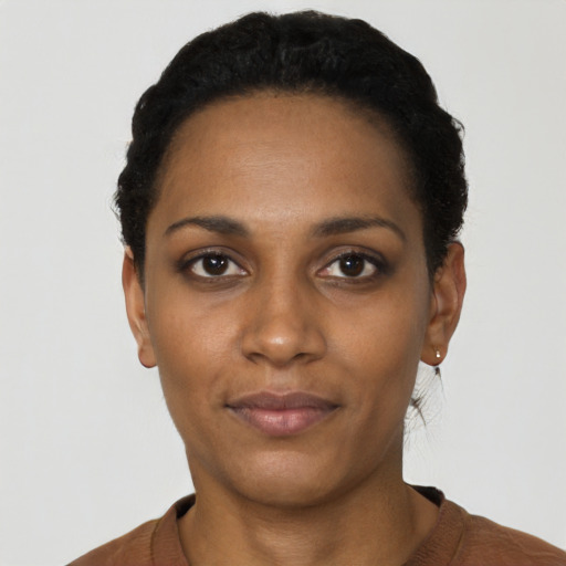 Neutral black young-adult female with short  black hair and brown eyes