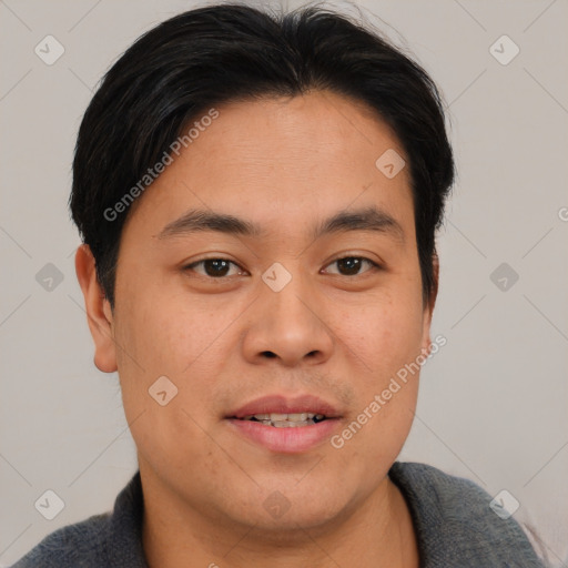 Joyful asian young-adult male with short  brown hair and brown eyes