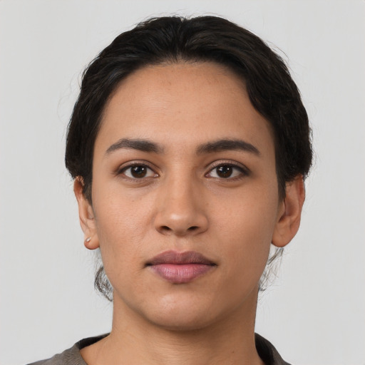 Neutral latino young-adult female with short  black hair and brown eyes