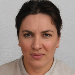 Joyful white adult female with short  brown hair and brown eyes