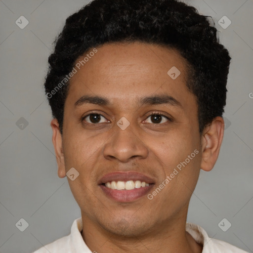 Joyful latino young-adult male with short  brown hair and brown eyes