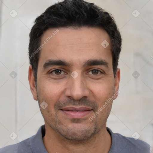 Joyful white young-adult male with short  black hair and brown eyes