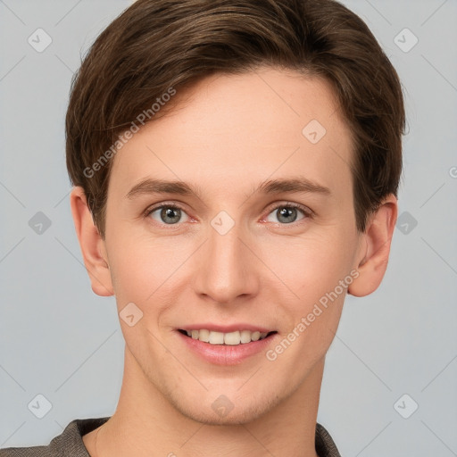 Joyful white young-adult female with short  brown hair and grey eyes