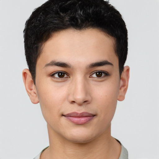 Joyful latino young-adult male with short  brown hair and brown eyes