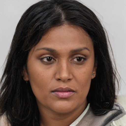 Joyful asian young-adult female with long  brown hair and brown eyes