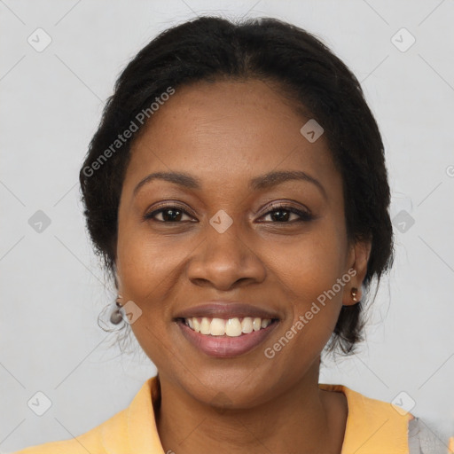 Joyful black young-adult female with short  brown hair and brown eyes