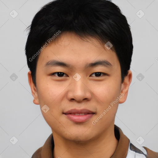 Joyful asian young-adult male with short  black hair and brown eyes