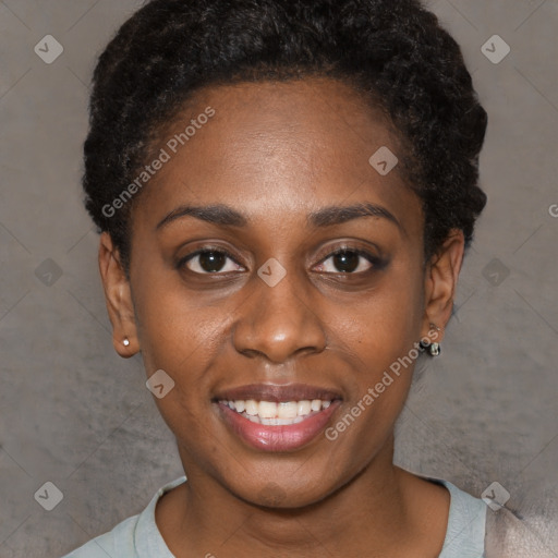 Joyful black young-adult female with short  black hair and brown eyes