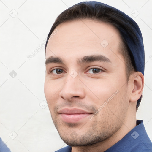 Neutral white young-adult male with short  black hair and brown eyes