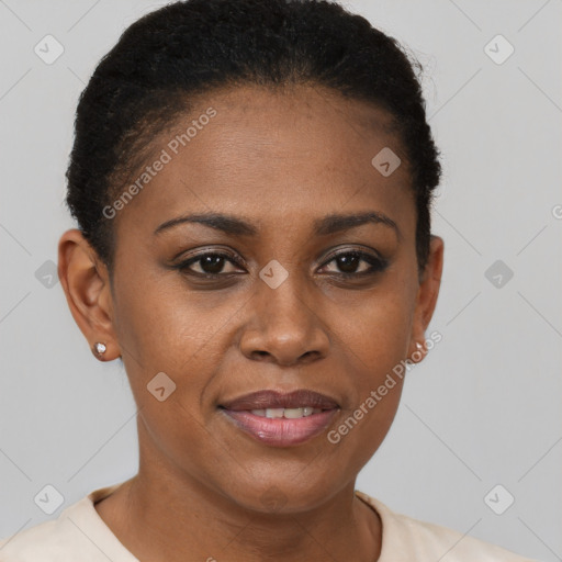 Joyful black young-adult female with short  brown hair and brown eyes