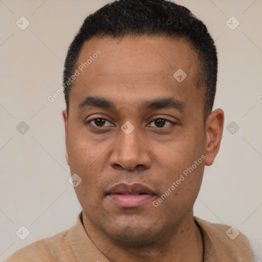 Neutral latino young-adult male with short  black hair and brown eyes