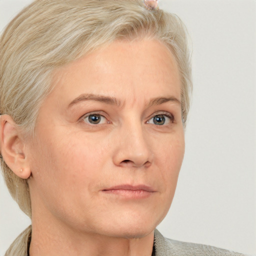 Neutral white adult female with short  blond hair and blue eyes