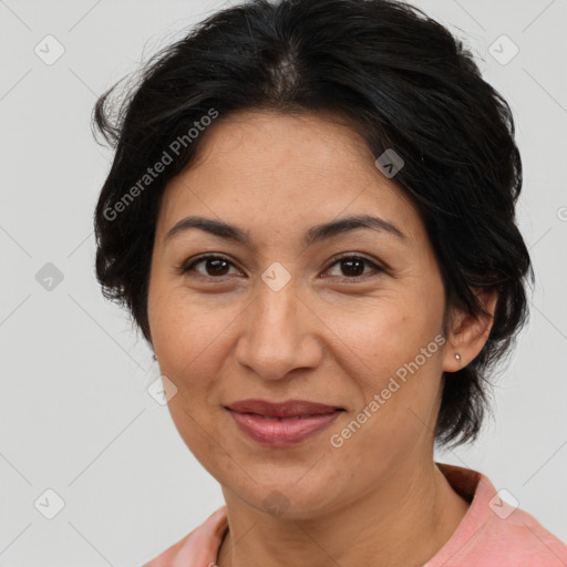 Joyful latino adult female with medium  brown hair and brown eyes