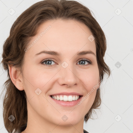 Joyful white young-adult female with medium  brown hair and green eyes