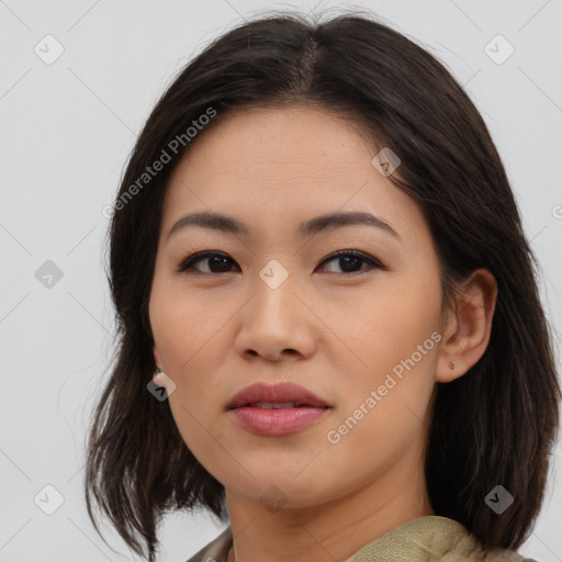 Joyful asian young-adult female with medium  brown hair and brown eyes