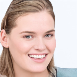 Joyful white young-adult female with long  brown hair and blue eyes