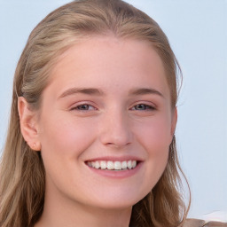 Joyful white young-adult female with long  brown hair and blue eyes