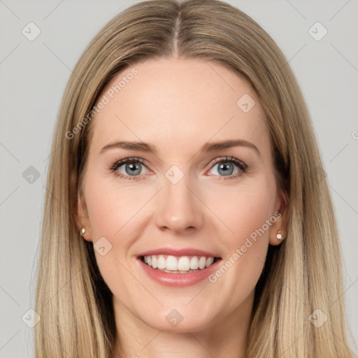 Joyful white young-adult female with long  brown hair and grey eyes