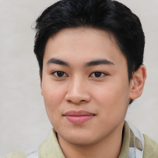 Joyful asian young-adult male with short  brown hair and brown eyes