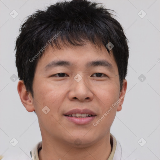 Joyful asian young-adult male with short  brown hair and brown eyes