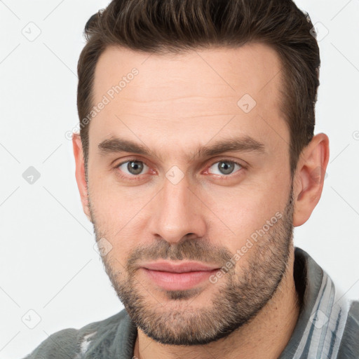 Neutral white young-adult male with short  brown hair and brown eyes