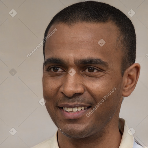 Joyful latino young-adult male with short  brown hair and brown eyes